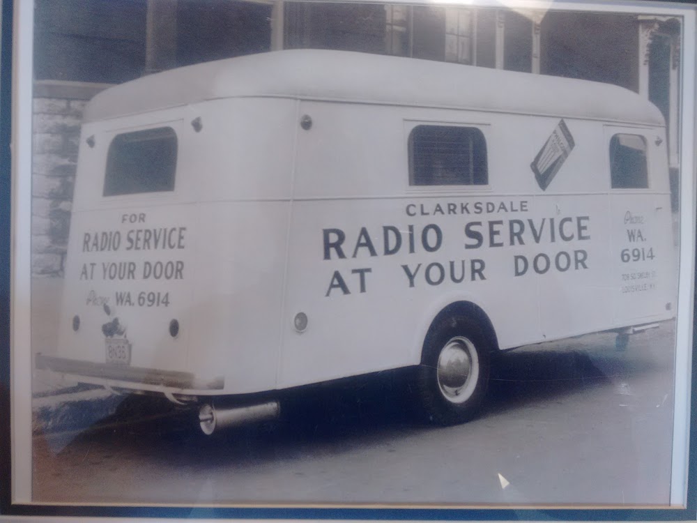 A historic Clarksdale service truck with the words Radio Service at Your Door painted on its side